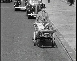 Vinyls: Syd Walker Carrying Vinyls to Use For War Materials