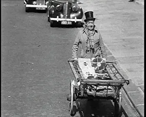 Vinyls: Syd Walker Carrying Vinyls to Use For War Materials