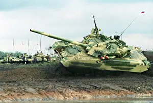 Obstacles: T-80U tank clearing obstacles at full speed, 1997