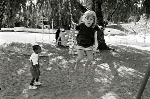 Tabitha: Tabitha, Ken Oosterbroek's daughter playing on a swing