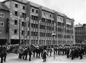 Kreuzberg: Taking down the Golden Flag of a model plant, 1940