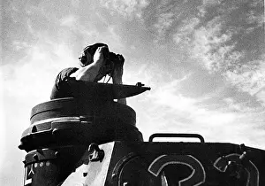 Hatch: Tank commander in the hatch of his tank. Scene from