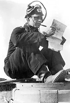 Hear: Tank commander studying maps