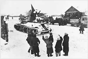 Liberates: TANK LIBERATES VILLAGE