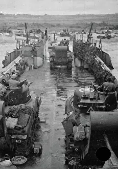Stacks: Tanks off-loading from an LCT