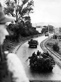 Maintain: Tanks on a street on the Western front. The tanks