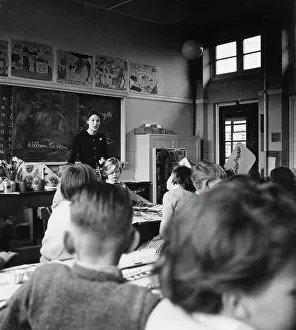 Chalked: Teacher with class of primary school children