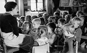 Attentive: Teacher and pupils, 1930