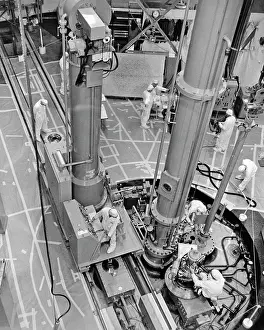 Fueling: Technicians Fueling Nuclear Electric Power Reactor