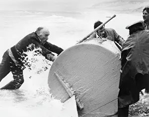 Capsized: Ted McNamara retrieving barrel, Sennen Cove, Cornwall