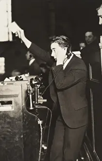 20 30 Years Old: Telephone clerk waving a note and calling a trader