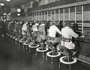 Earphones: Telephone operators working on an international