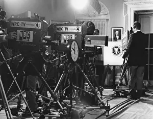 Reunification: Television cameras at an event at the White House