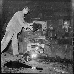 Spillage: Tending the fire beneath a kiln at a pottery works