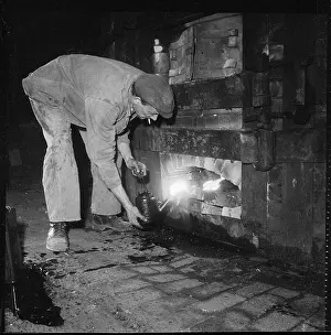 Spillage: Tending the fire beneath a kiln at a pottery works