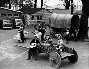 Ernie: Tennessee Ernie playing guitar while others dance
