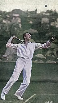 Clothier: Tennis player Anthony Wilding serving, 1905