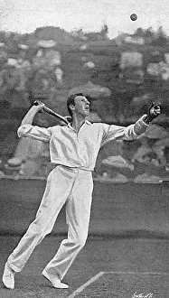 Clothier: Tennis player Anthony Wilding serving, 1905