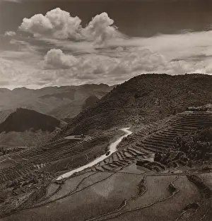 Lcgr1411: Terraced fields and roadway in a mountainous region