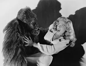 Scream: Terrified woman being attacked by gorilla