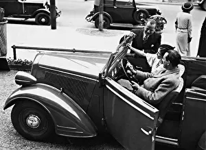Salesman: Testing a car in a dealership, 1935