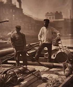 Lightermen: Thames lightermen standing on barge, London