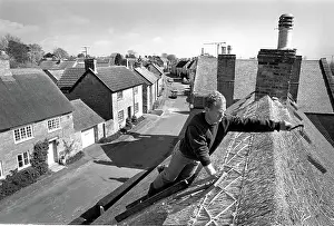Thatch: Thatcher working on Somerset cottage -2