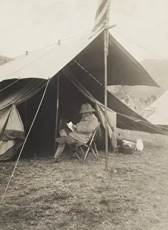 Lcgr1705: Theodore Roosevelt reading in front of his tent