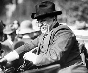 Selective: Theodore Roosevelt riding in a car with a big