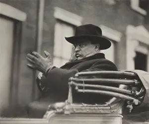 Ex President: Theodore Roosevelt (waving hat) and Charles Evans