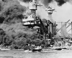 Modernized: Thick smoke billows from the burning USS West