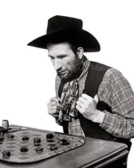Perplexed: Thoughtful Man Cowboy Playing Checkers Game on