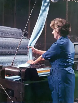 Employee: Threads entering a weaving machine