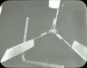 Revolving: Three-cylinder engine revolving on fixed crankshaft