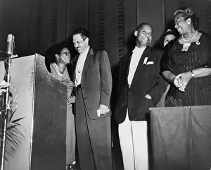 Assoc: Thurgood Marshall standing with educator ?