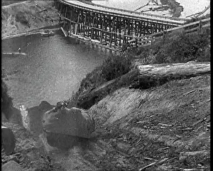 Chute: Timber Going Down A Chute Into The River