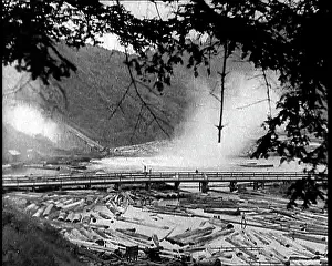 Chute: Timber Going Down A Chute Into The River