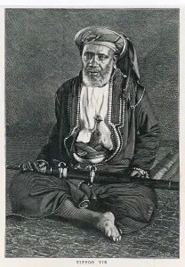 Tippu: Tippu Tib, cross-legged