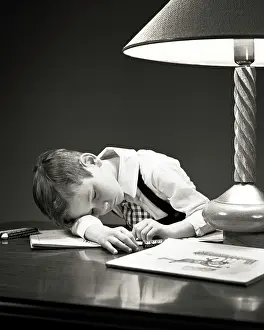 Coloring: Tired Young Boy Fallen Asleep over his Coloring Book