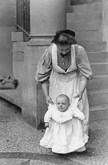 Attendants: Toddler learns to walk with nanny, 1909