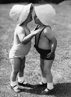 Confidences: Two toddlers exchanging confidences