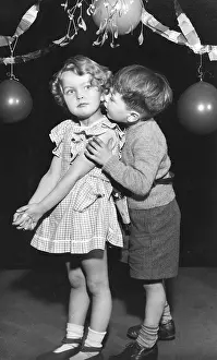 Gingham: Two toddlers under the mistletoe