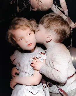 Garlands: Two toddlers under the mistletoe