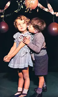 Garlands: Two toddlers under the mistletoe