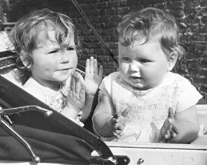 Smocking: Two toddlers in a pram
