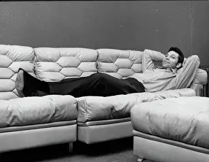 Techno: Tom Jones, singer, relaxing on his sofa at home