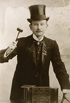 Auctioneer: Tom Norman - Auctioneer, raising his gavel