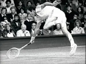 Knocked: Tom Okker in tennis match at Wimbledon