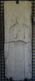 Coruna: Tombstone with prayer figure in bas-relief