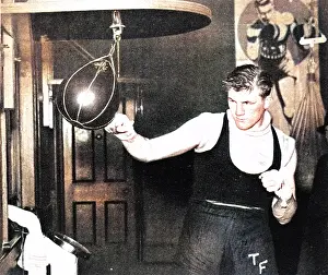 Tonypandy: Tommy Farr using a punch ball, 1937
